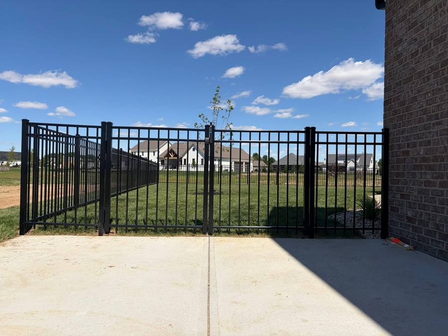 Black aluminum gate at a residential driveway
